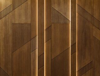 Nowoczesne trendy w dekoracji wnętrz: Panele ścienne z drewna w rzeźbionym wzorze pionowym